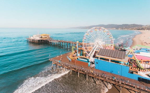 Santa Monica Pier Santa Monica Pier has a lot to offer from roller coasters, Ferris Wheel and the gorgeous blue beach.