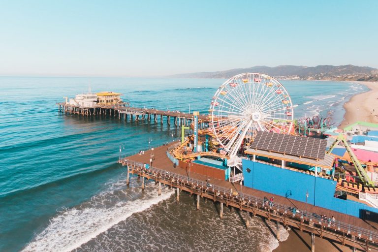 Santa Monica Pier has a lot to offer from roller coasters, Ferris Wheel and the gorgeous blue beach.